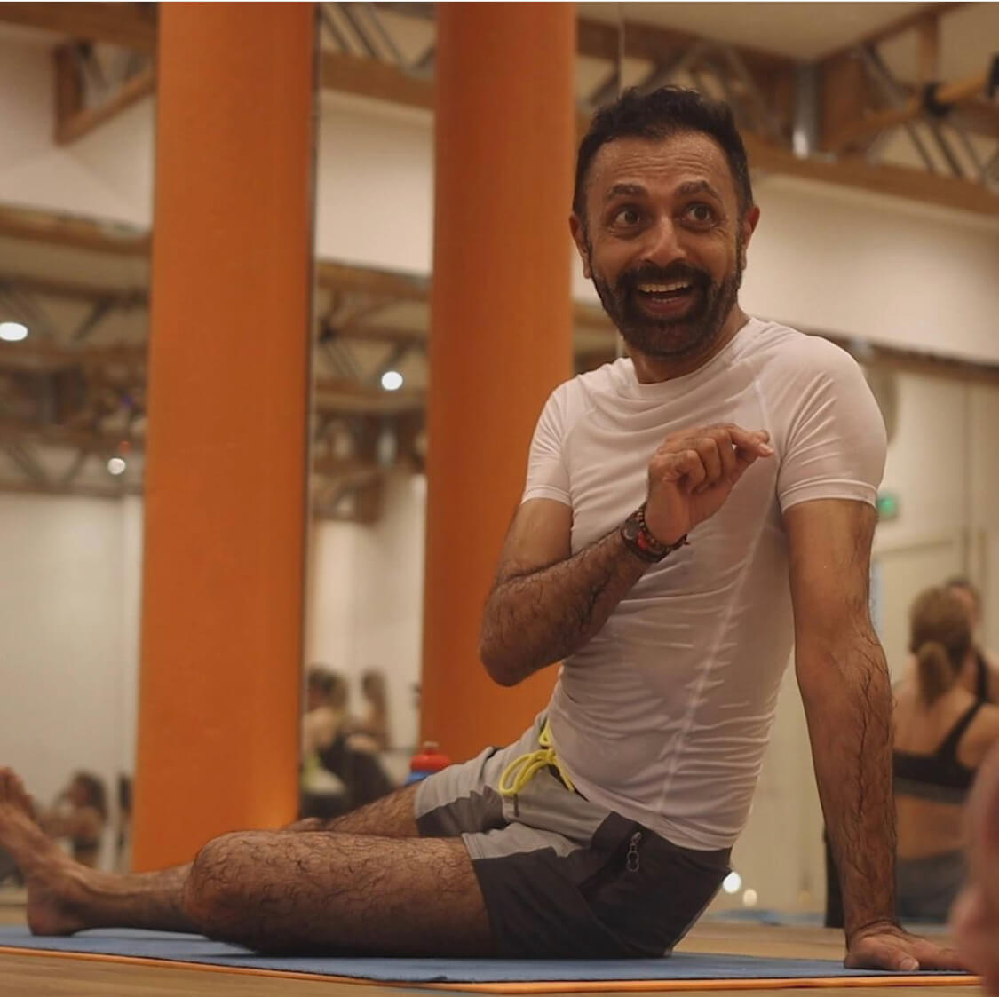 seated gay yoga insrtructor